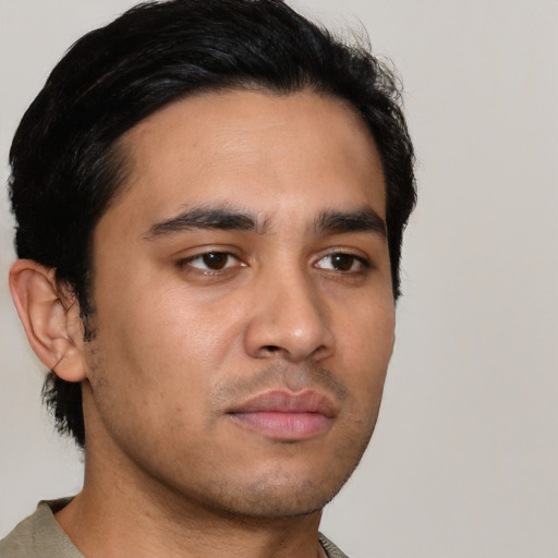 Neutral latino young-adult male with short  black hair and brown eyes