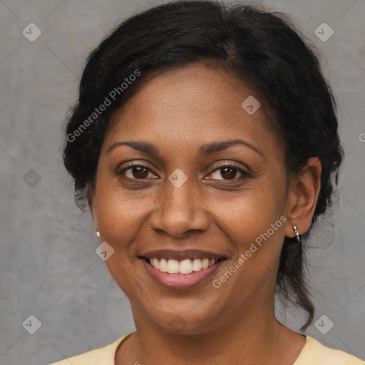 Joyful black adult female with medium  brown hair and brown eyes