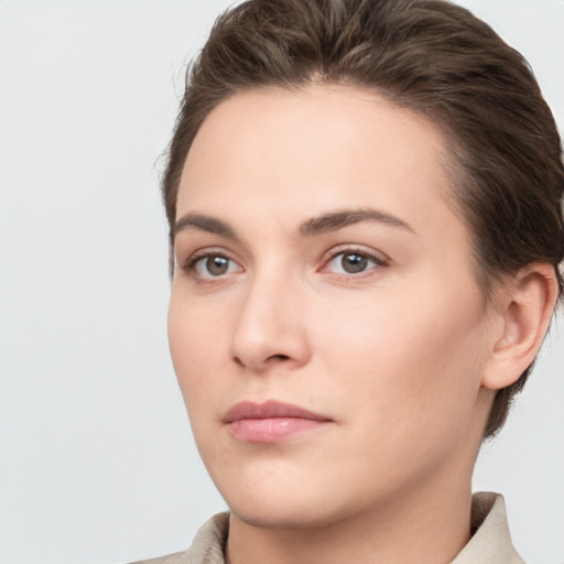 Neutral white young-adult female with short  brown hair and brown eyes