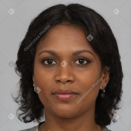 Joyful black young-adult female with medium  brown hair and brown eyes