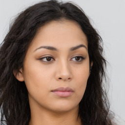 Neutral latino young-adult female with long  brown hair and brown eyes