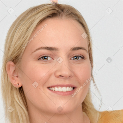 Joyful white young-adult female with long  brown hair and blue eyes