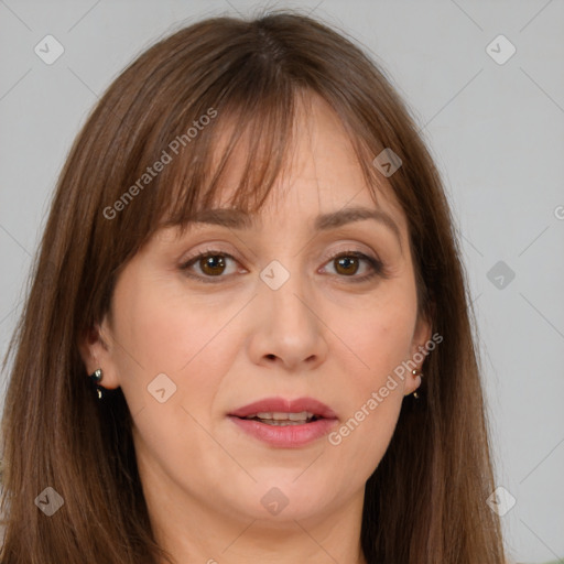 Joyful white adult female with long  brown hair and brown eyes