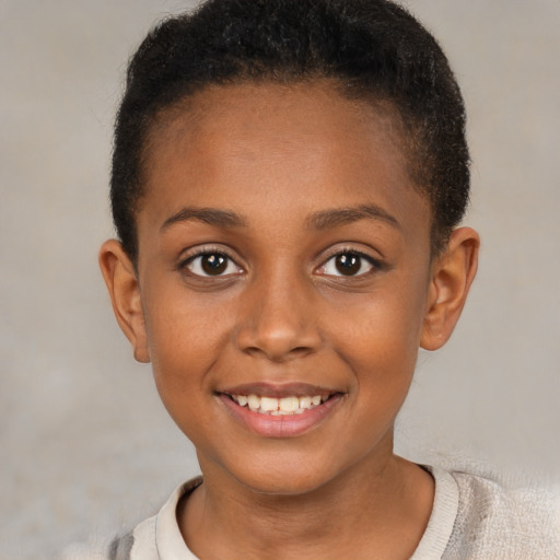 Joyful black child female with short  brown hair and brown eyes