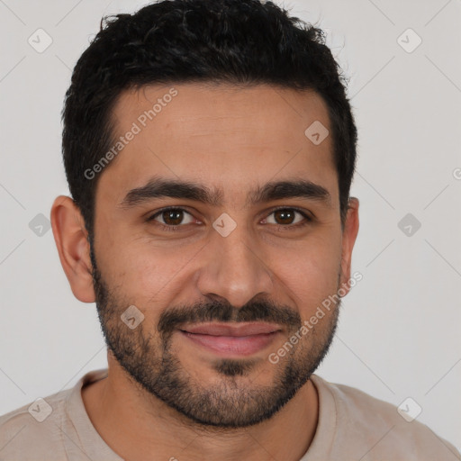 Joyful white young-adult male with short  black hair and brown eyes