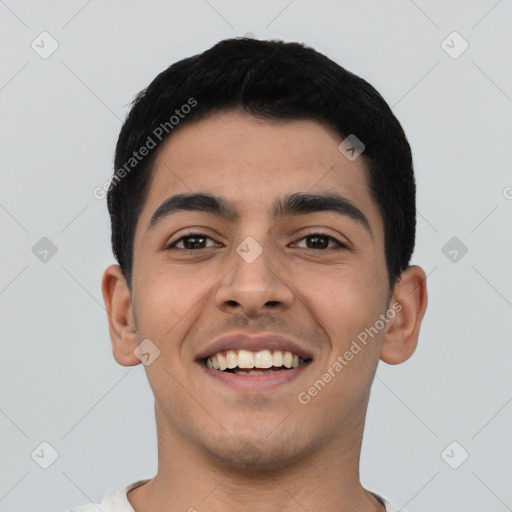 Joyful latino young-adult male with short  black hair and brown eyes