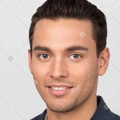 Joyful white young-adult male with short  brown hair and brown eyes