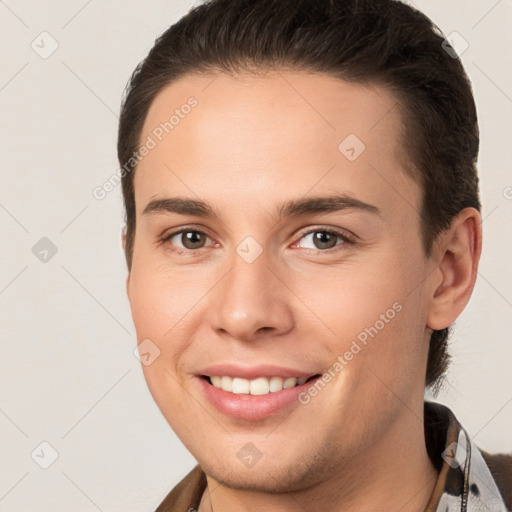 Joyful white young-adult female with short  brown hair and brown eyes