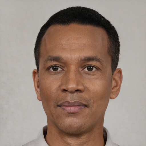 Neutral black adult male with short  black hair and brown eyes