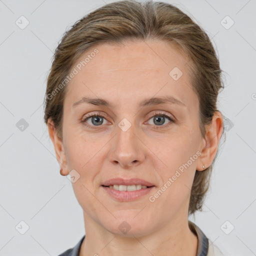 Joyful white adult female with short  brown hair and grey eyes