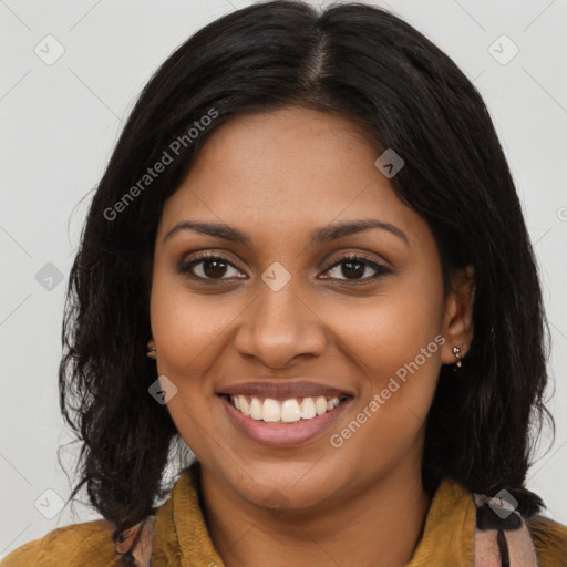 Joyful black young-adult female with long  brown hair and brown eyes