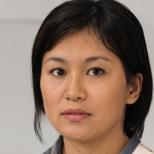 Neutral asian young-adult female with medium  brown hair and brown eyes