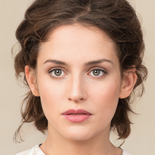 Neutral white young-adult female with medium  brown hair and green eyes