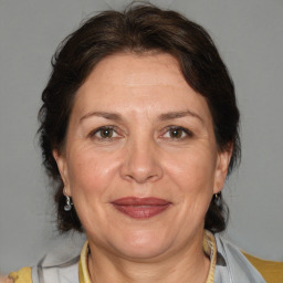 Joyful white adult female with medium  brown hair and brown eyes