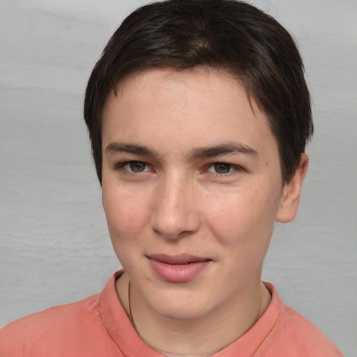 Joyful white young-adult female with short  brown hair and brown eyes