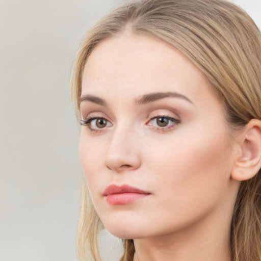 Neutral white young-adult female with long  brown hair and brown eyes