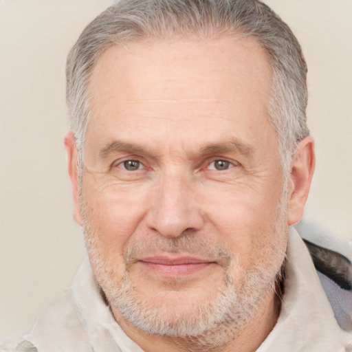 Joyful white middle-aged male with short  gray hair and brown eyes