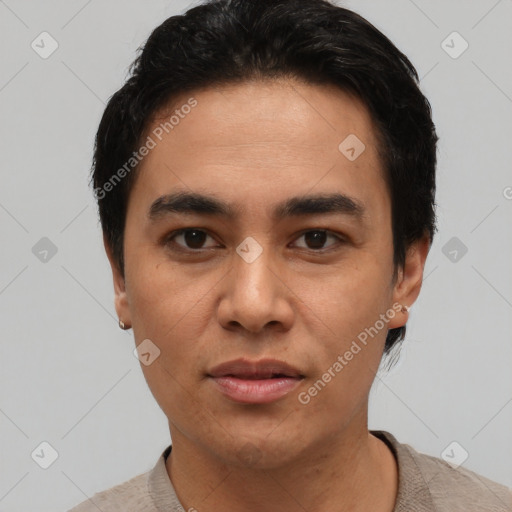 Joyful asian young-adult male with short  black hair and brown eyes