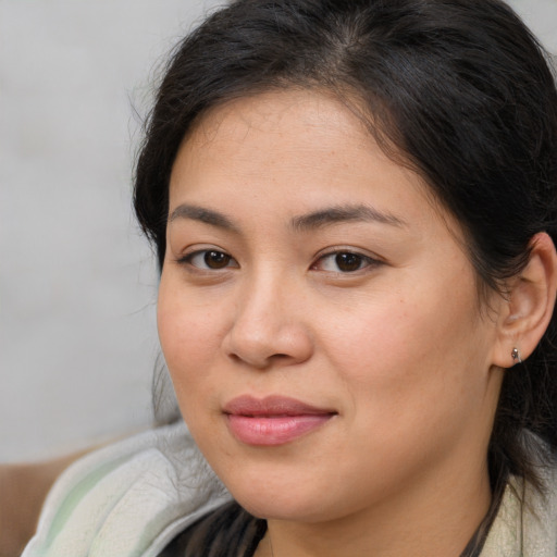Joyful white young-adult female with medium  brown hair and brown eyes