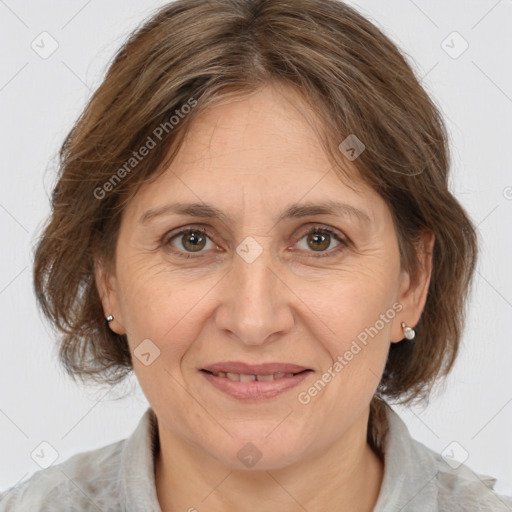 Joyful white adult female with medium  brown hair and grey eyes