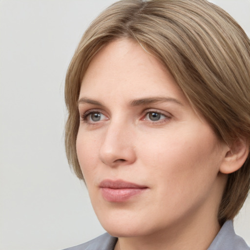 Neutral white young-adult female with medium  brown hair and grey eyes