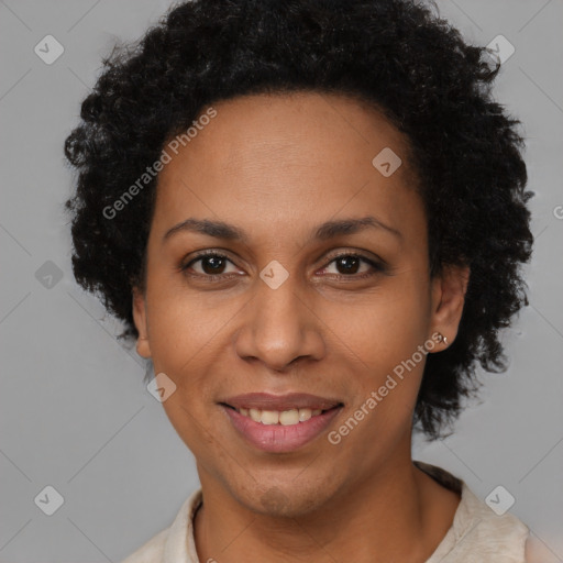 Joyful black adult female with short  brown hair and brown eyes