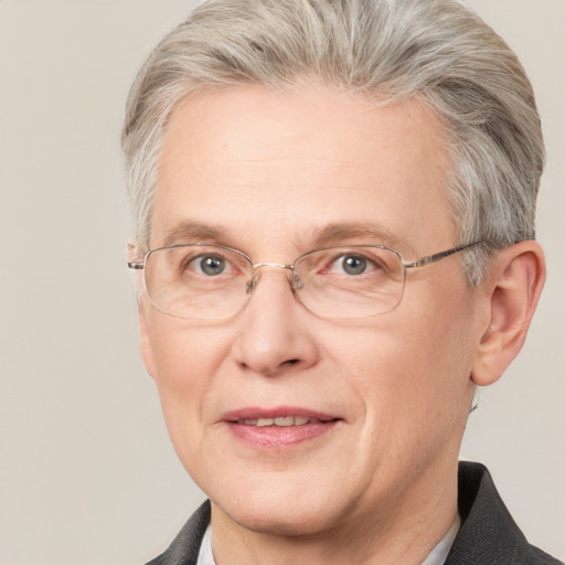 Joyful white middle-aged male with short  gray hair and grey eyes