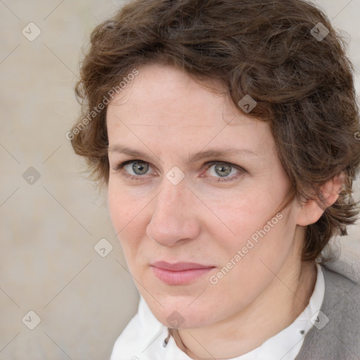 Joyful white adult female with medium  brown hair and blue eyes