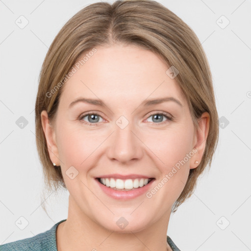 Joyful white young-adult female with medium  brown hair and blue eyes