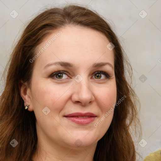 Joyful white adult female with long  brown hair and green eyes