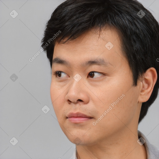 Neutral asian young-adult male with short  black hair and brown eyes