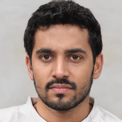 Neutral latino young-adult male with short  black hair and brown eyes