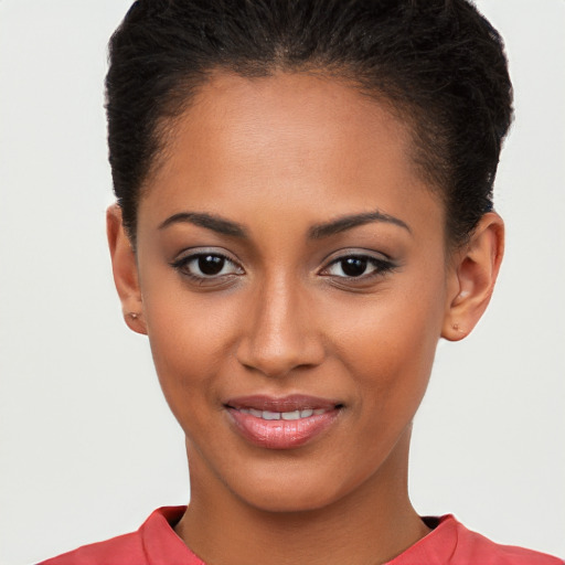 Joyful latino young-adult female with short  brown hair and brown eyes