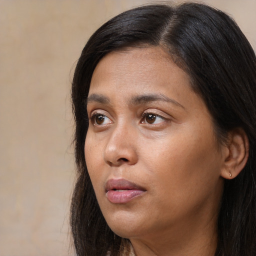 Neutral asian adult female with long  black hair and brown eyes