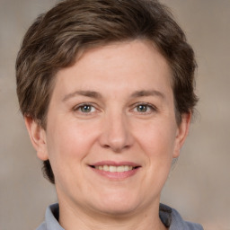 Joyful white adult female with short  brown hair and brown eyes