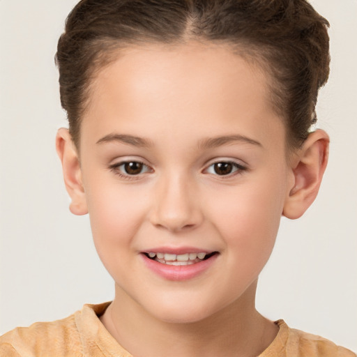 Joyful white child female with short  brown hair and brown eyes