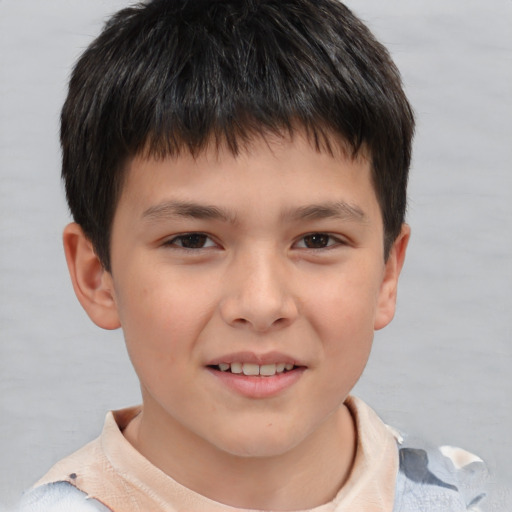 Joyful white child male with short  brown hair and brown eyes