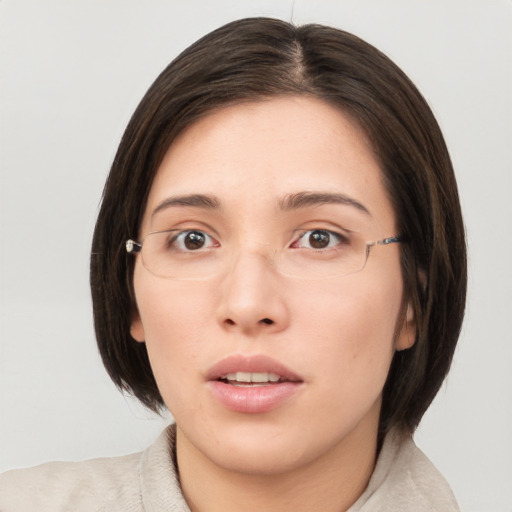 Neutral white young-adult female with medium  brown hair and brown eyes