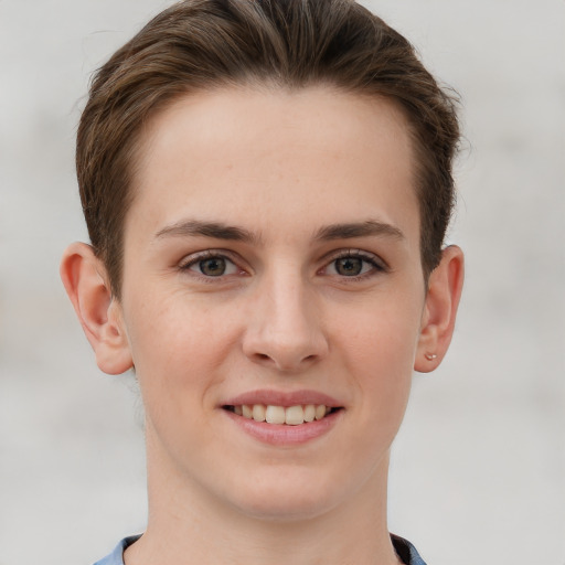 Joyful white young-adult female with short  brown hair and grey eyes