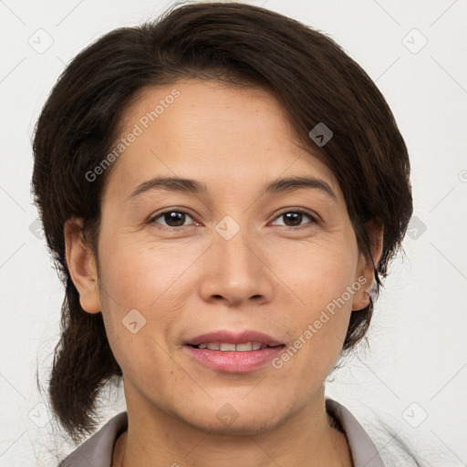 Joyful white adult female with medium  brown hair and brown eyes