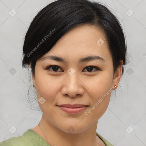 Joyful asian young-adult female with medium  black hair and brown eyes