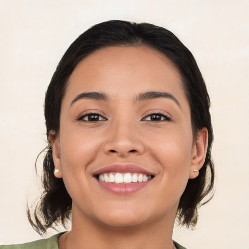 Joyful white young-adult female with medium  black hair and brown eyes