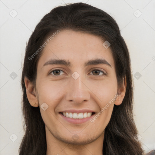 Joyful white young-adult female with long  brown hair and brown eyes