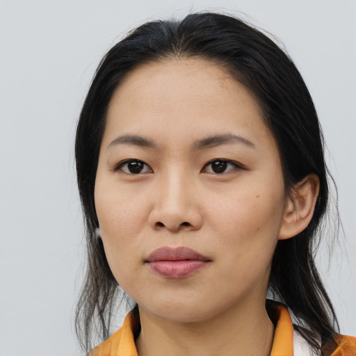 Joyful asian young-adult female with medium  black hair and brown eyes