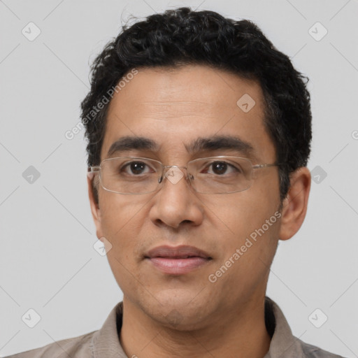 Neutral latino adult male with short  black hair and brown eyes