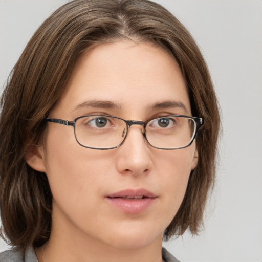 Neutral white young-adult female with medium  brown hair and grey eyes