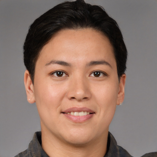 Joyful asian adult female with short  brown hair and brown eyes