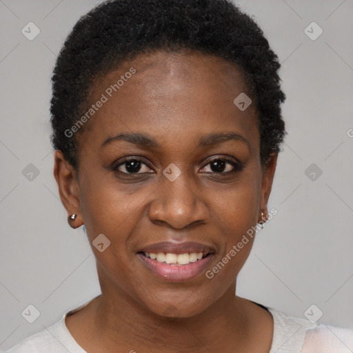 Joyful black young-adult female with short  black hair and brown eyes