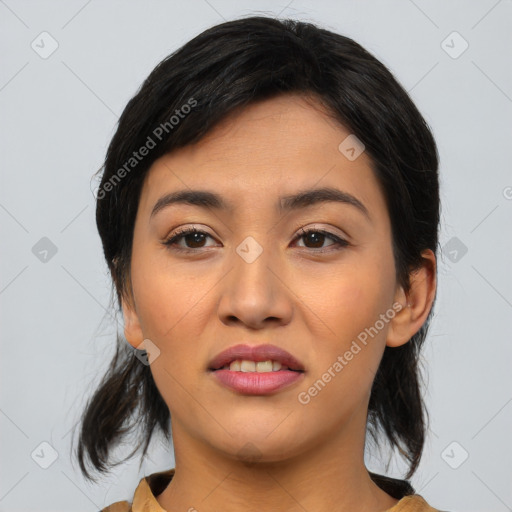 Joyful asian young-adult female with medium  black hair and brown eyes