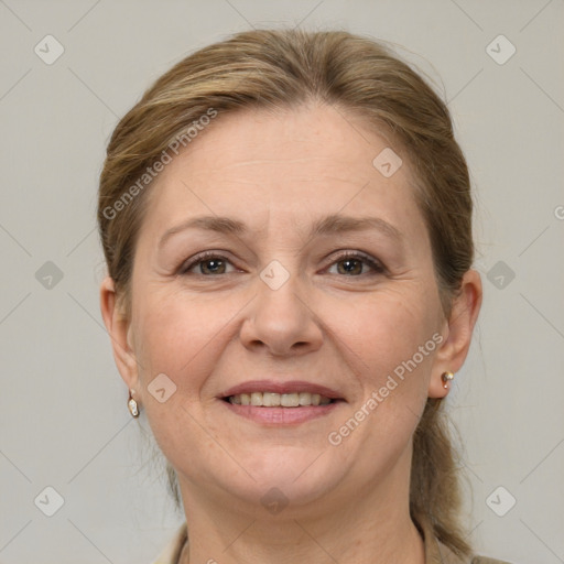 Joyful white adult female with medium  brown hair and grey eyes